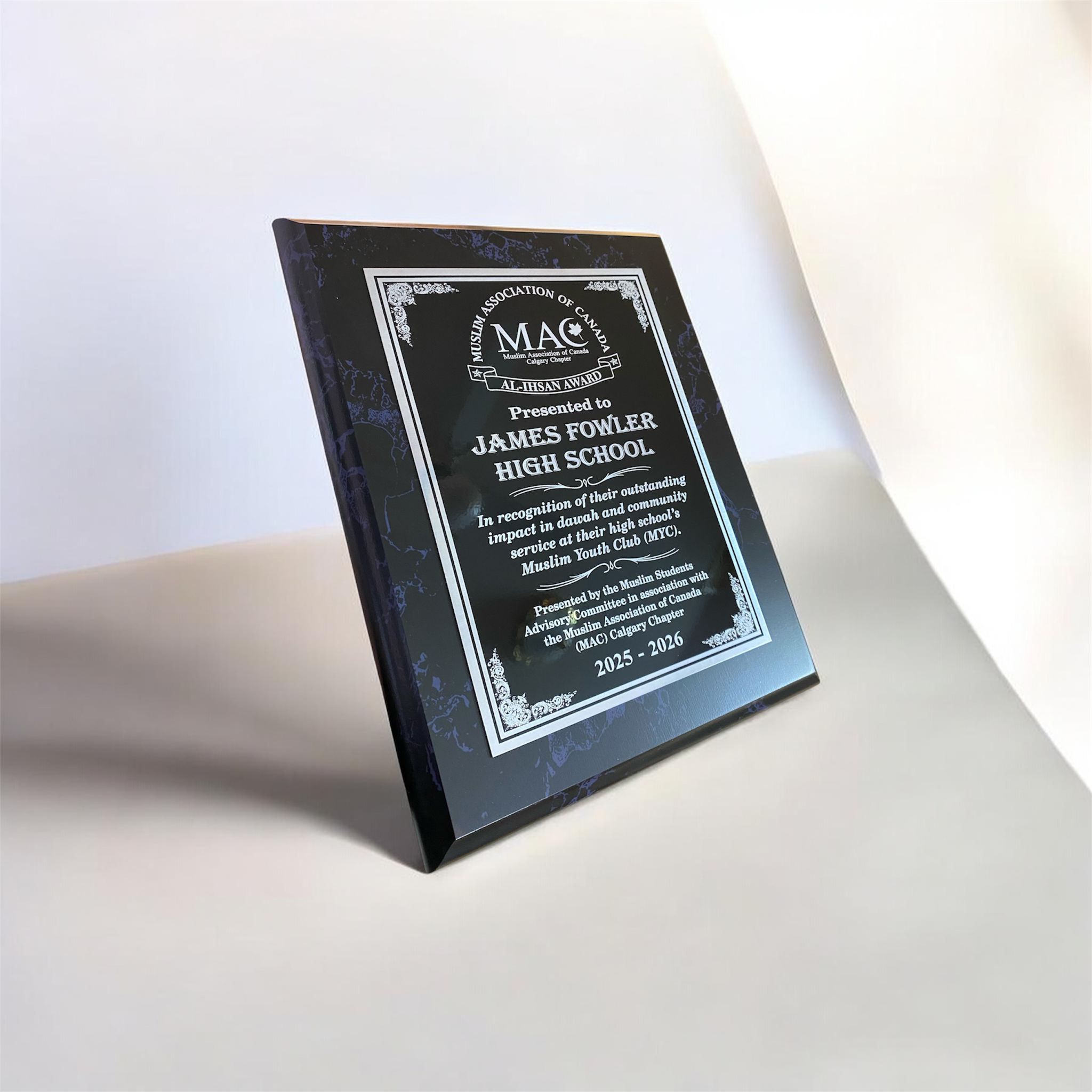 Custom glass award engraved with corporate logo